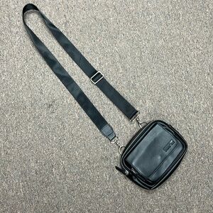 Crossbody black leather bag